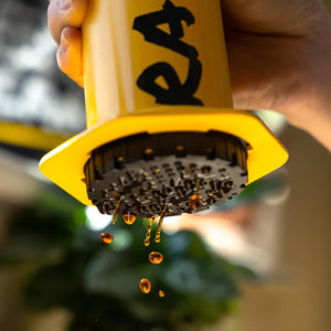 coffee pouring from an Aeropress Coffee Maker