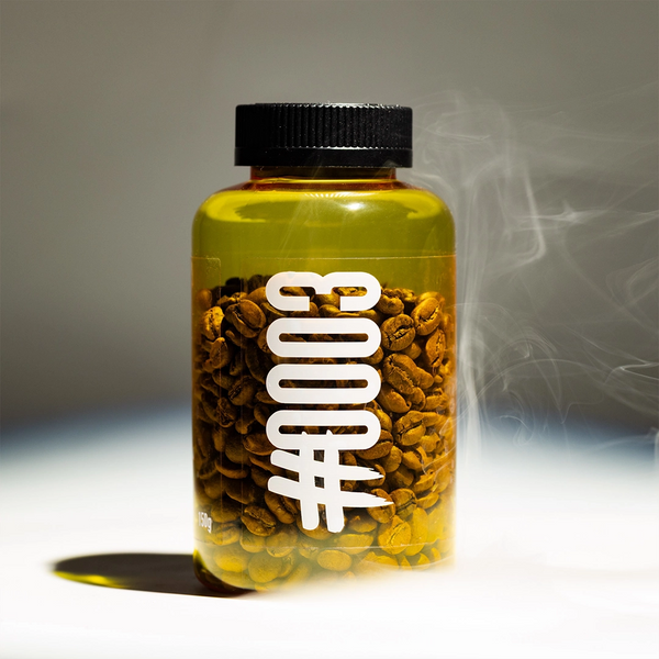 Clear container with coffee beans and visible brand logo on a gradient background
