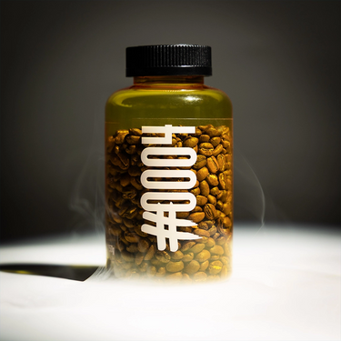 Jar filled with coffee beans labeled '#0004' on a dark background