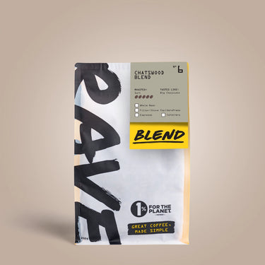 A bag of RAVE coffee beans labeled Chatswood Blend Nº 6 comes in white packaging with bold black and yellow text, a 1% for the Planet logo, and the slogan Great Coffee, Made Simple—a great dark roast choice.
