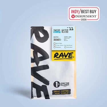 A white and yellow RAVE COFFEE bag labeled Swiss Water Decaf Blend Nº 11 stands upright, showcasing its naturally decaffeinated coffee made with the Swiss water process. A Best Buy 2026 badge from The Independent is in the top right corner.