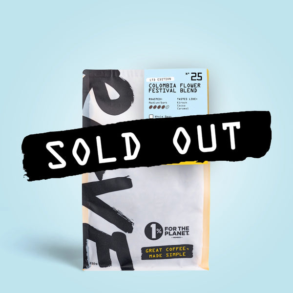 A bag of RAVE COFFEE’s Colombia Flower Festival Blend Nº 25 with a SOLD OUT banner across the front. The packaging features bold text and a blue label, set against a light blue background—highlighting this limited-release, premium Colombian coffee with a medium-dark roast profile.