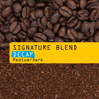 Close-up of whole beans and ground coffee with a yellow label reading Signature Blend Decaf N° 1D. 