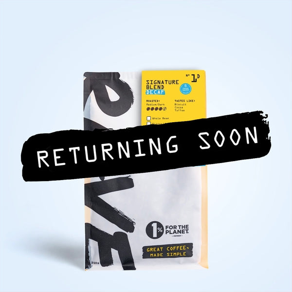 A coffee bag labeled Signature Blend Decaf N° 1D from RAVE COFFEE is mostly covered by a bold black banner with white text that reads RETURNING SOON. The background features a light blue gradient, highlighting this natural decaf coffee crafted using the Swiss water process.