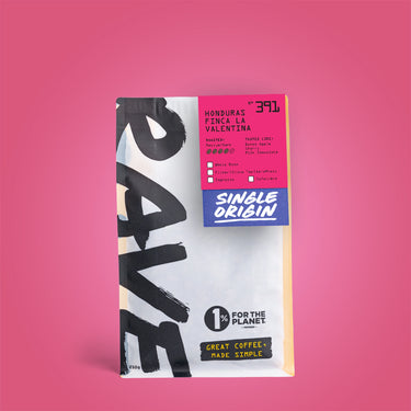 A 250g bag of Honduras Finca La Valentina Nº 391 coffee, featuring bold black lettering on a white background and a pink label with tasting notes of baked apple, cherry, and milk chocolate.