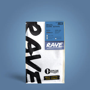 A bag of RAVE COFFEE Brazil Guima Estate Nº 303 with a blue and white design, classic coffee notes, roast info, certification icons, and the “1% for the Planet” slogan. Great coffee, made simple against a blue background.