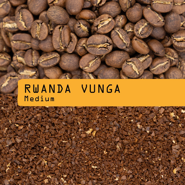A close-up shows whole coffee beans above ground coffee, separated by a yellow label reading 