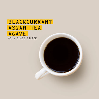 A white cup of RAVE COFFEE Rwanda Kinini Anaerobic Nº 331 sits on a light beige surface. Yellow text highlights Blackcurrant Assam Tea Agave; below, smaller text reads as a black filter.