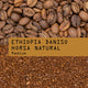 A close-up shows whole Ethiopia Daniso Horsa Natural Nº 332 coffee beans above ground coffee, overlaid with a brown label reading: RAVE COFFEE ETHIOPIA DANISO HORSA NATURAL Nº 332 Medium.