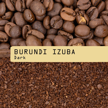Close-up of whole Burundi Izuba Nº 334 coffee beans above ground coffee, separated by a beige label reading BURUNDI IZUBA Nº 334 Dark in black typewriter font—showcasing RAVE COFFEE’s sweet cup profile.