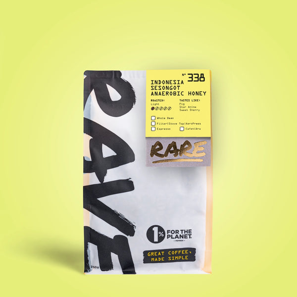 A yellow RAVE COFFEE bag shows “Indonesia Sesongot Anaerobic Honey Nº 338” and tasting notes, highlighting Indonesian coffee’s unique anaerobic honey process. Bold black text and a “1% for the Planet” logo feature on the packaging.