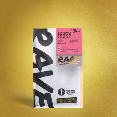 A white and pink RAVE COFFEE bag labeled Guatemala Esperanza Pacamara Nº 344 rests on a gold background, featuring bold black text, a gold RARE stamp, and the 1% For The Planet logo to highlight this unique Guatemala coffee.