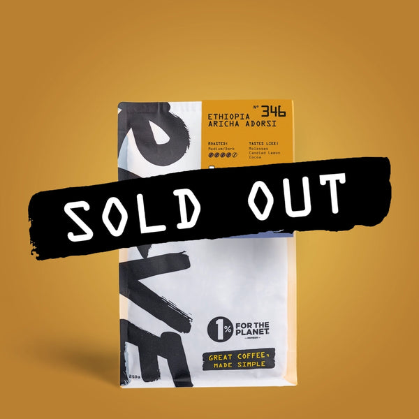 A bag of RAVE COFFEE washed process coffee labeled “Ethiopia Aricha Adorsi Nº 346” sits against a brown background, featuring a bold black stripe across the center with “SOLD OUT” in white letters.