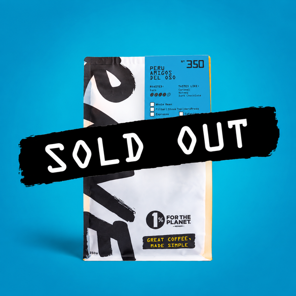 A bag of RAVE COFFEE’s Peru Amigos del Oso Nº 350, marked with a bold black “SOLD OUT” stamp, set against a vibrant blue background—emphasizing its connection to bear habitat conservation.