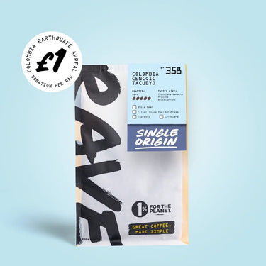 A bag of RAVE COFFEE’s Colombia Cencoic Tacueyo Nº 358 – £1 Earthquake Relief features a £1 Colombia Earthquake Appeal sticker in the top left corner. The packaging highlights their commitment to sustainable coffee with the messages “Great coffee, made simple” and “1% for the planet.”.