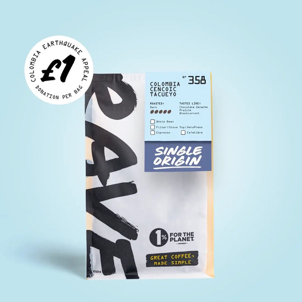 A bag of RAVE COFFEE’s Colombia Cencoic Tacueyo Nº 358 – £1 Earthquake Relief features a £1 Colombia Earthquake Appeal sticker in the top left corner. The packaging highlights their commitment to sustainable coffee with the messages “Great coffee, made simple” and “1% for the planet.”.