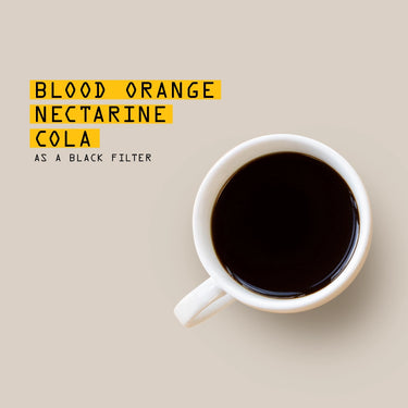 White mug with dark liquid on a beige background, text 'BLOOD ORANGE NECTARINE COLA AS A BLACK FILTER' above.