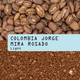 Coffee beans and ground coffee with 'Colombia Jorge Mira Rosado' label