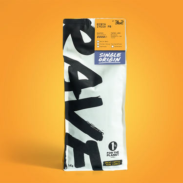 A 1kg bag of single-origin coffee from the brand Cafe Amigo, featuring a white and black design with a blue 'Single Origin' label, set against a solid orange background.