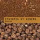 Coffee beans and ground coffee with 'ETHIOPIA KY KEBERO Medium' label.