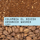 A close-up product graphic for coffee beans showing roasted coffee beans at the bottom, coarse ground coffee at the top, and a light blue text banner across the center reading 'COLOMBIA EL DIVISO ADVANCED WASHED Light'.