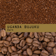 Coffee bean variety label for Uganda Bujuku Dark, showing a top section of ground coffee beans and a bottom section of whole roasted coffee beans, with a tan label across the center reading 'UGANDA BUJUKU Dark'.