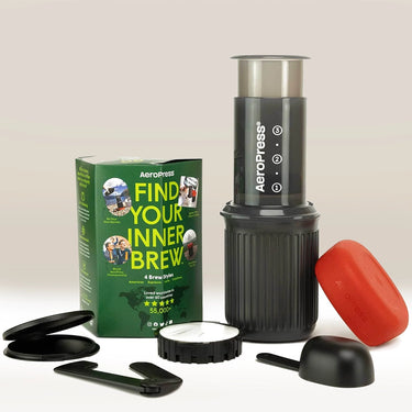 The AeroPress Go by Aeropress includes a plunger, filter cap, scoop, stirrer, red filter holder, and comes in a box labeled 