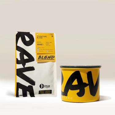 A yellow and white Rave coffee bag labeled “RAVE Blend” is positioned behind a matching Rave branded Airscape coffee storage canister with bold black lettering, both set against a neutral background—perfect for keeping your fresh roasted coffee at its best. This is the Branded Airscape with Coffee by Rave.