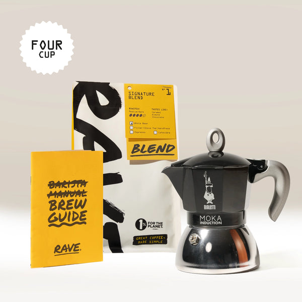 The Bialetti Induction Stove Top Gift Set by Bialetti, featuring a four-cup moka pot, a bag of Rave Coffee Blend beans, and a yellow brew guide booklet, is displayed against a plain background.