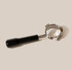 RAVE Coffee Bottomless Portafilter for 54mm espresso machines, featuring a black handle and a chrome head.