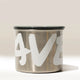 The Branded Airscape Coffee Storage Container by Rave features stainless steel, a black lid, and bold white “AVE” lettering on its surface, shown against a neutral background.