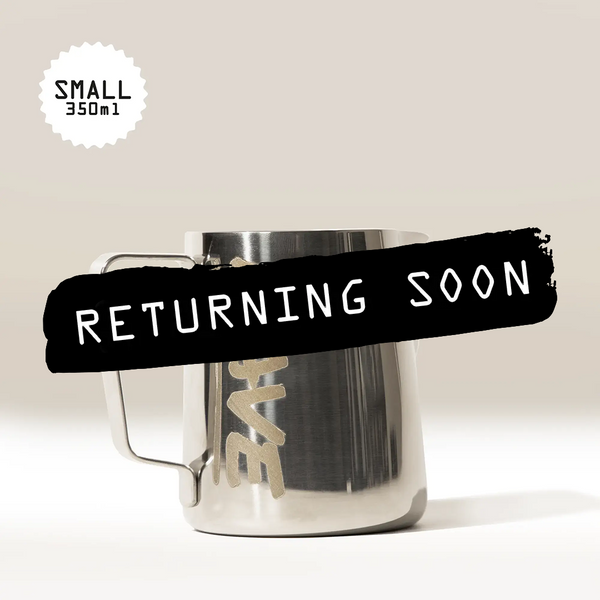A small 350ml Rave Milk Jug from RAVE COFFEE—ideal for steaming microfoam or as a standout milk jug in your barista accessories collection—features the word LOVE partially visible, with a black banner displaying RETURNING SOON in bold white text.