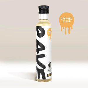 A clear bottle of Rave Coffee Syrups by RAVE COFFEE stands upright against a light background, with a round caramel graphic reading “CARAMEL SYRUP” to the right—ideal for UK blended coffee lovers.