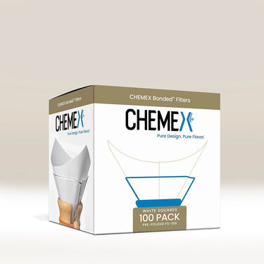 Chemex Squares Bonded Filters (100) by Chemex are cone-shaped speciality fibre paper filters. The White Squares 100 Pack features filter illustrations and a Chemex coffee maker with a filter on a white background.