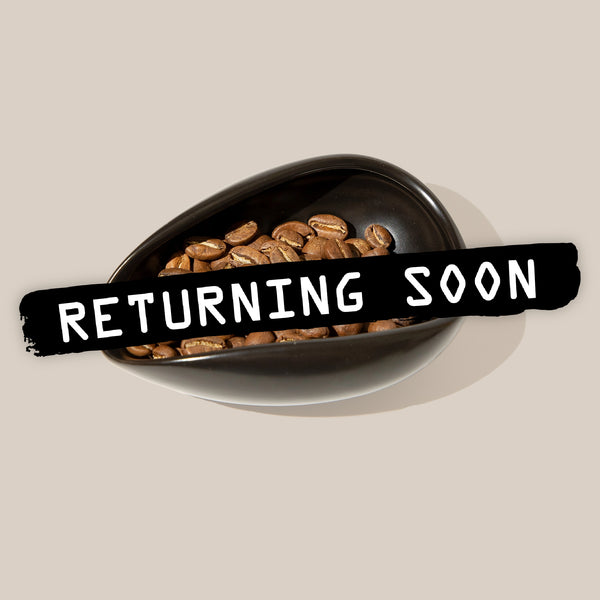 Coffee Bean doser with return soon label over it 