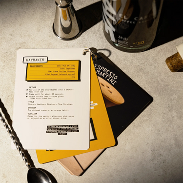 Rave Coffee cocktail guide with bar tools and ingredients for El Carmen Coffee Liqueur drinks.