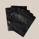 Five Ravecoffee Zip Lock Bags with Degassing Valve are fanned out on a light beige background. Each resealable bag features a small one-way valve near the top to help keep your coffee fresh. Set includes 5 bags.