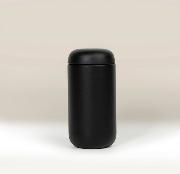 A matte black Fellow Carter Move Mug (12oz) with a matching lid.