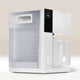 The Fellow Aiden Precision Drip Filter Coffee Maker by Fellow features a sleek white minimalist design, large water reservoir, digital display set to 6:30, matching carafe, and customizable temperature controls for perfect brewing on a neutral background.