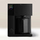 The Fellow Aiden Precision Drip Filter Coffee Maker by Fellow features a modern black design, a circular top-left display with colorful 