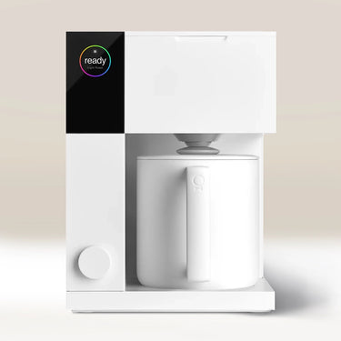 The Fellow Aiden Precision Drip Filter Coffee Maker by Fellow is a modern, minimalist white coffee maker with customizable temperature controls, a digital 