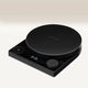 The Fellow Tally™ Pro Precision Scales by Fellow is a sleek black digital scale with a circular platform, LED display showing 0.0g, and control buttons—perfect for pour-over enthusiasts—shown against a light gradient background.