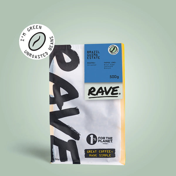 A 500g bag of RAVE COFFEE Brazil Guima Estate Green Coffee Beans stands upright on a light green background, displaying eco-friendly and 1% For The Planet logos with bold, modern packaging.