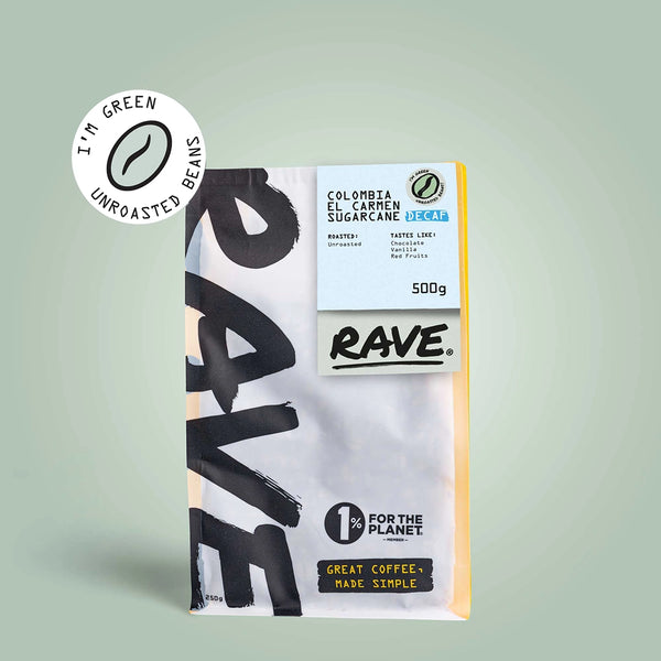 A 500g bag of RAVE COFFEE Colombia El Carmen DECAF Green Coffee Beans on a light green background. Packaging features IM GREEN, 1% For The Planet, and Great Coffee, Made Simple. Ideal for those seeking premium unroasted beans.