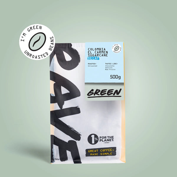 A 500g bag of RAVE COFFEE Colombia El Carmen DECAF Green Coffee Beans on a light green background. Packaging features IM GREEN, 1% For The Planet, and Great Coffee, Made Simple. Ideal for those seeking premium unroasted beans.