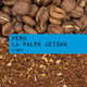 Peru La Palma Geisha Light coffee, showing roasted whole coffee beans at the top, a bright blue label with black text in the center, and ground coffee with coffee scrapings at the bottom.