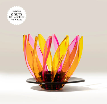 The Hario Suiren Ribs (set of 6) is a modern, sculptural set with curved, translucent yellow and pink ribs arranged vertically on a black base, inspired by the iconic Hario V60 Suiren dripper design.
