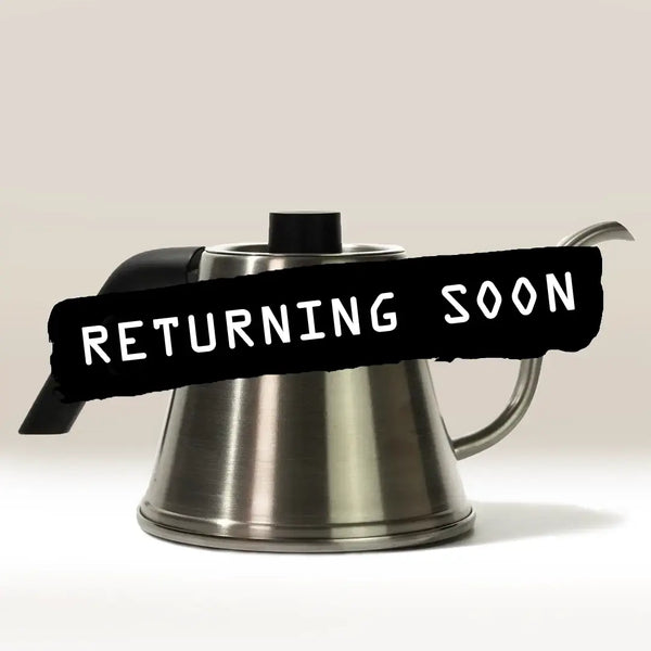 The Hario Tetsu Kasuya Pour Over Kettle by Hario is pictured with a black handle and lid against a plain background. “RETURNING SOON” is displayed in bold white text on a black banner. Ideal for precise pour over coffee preparation.