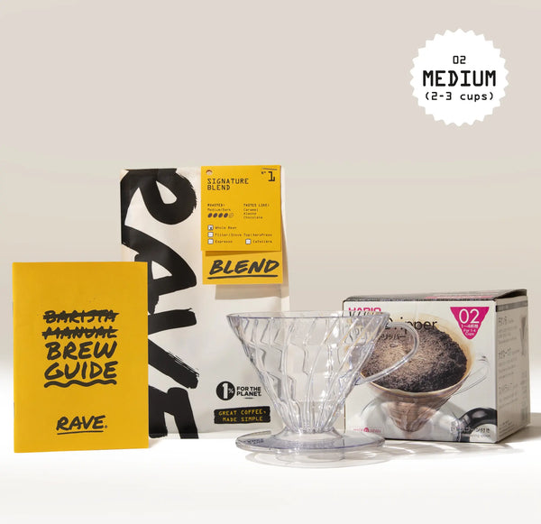 The Hario V60 Dripper Filter Coffee Gift Set by Hario includes a clear V60 dripper, yellow brew guide, and Rave Signature Blend—ideal for brewing 2-3 cups of fresh coffee at home.