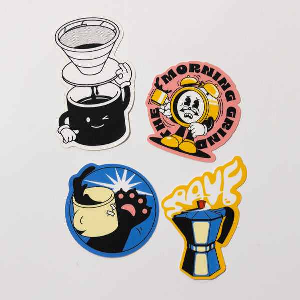 Sticker Pack Illustrated by Harry Knight: four colorful Rave Coffee-themed stickers featuring a smiling pour-over maker, tired clock in spacesuit, grumpy cat with raised paw, and moka pot with yellow steam spelling "SPUMF.